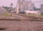 Empties on approach passing Benton Grain Elevator